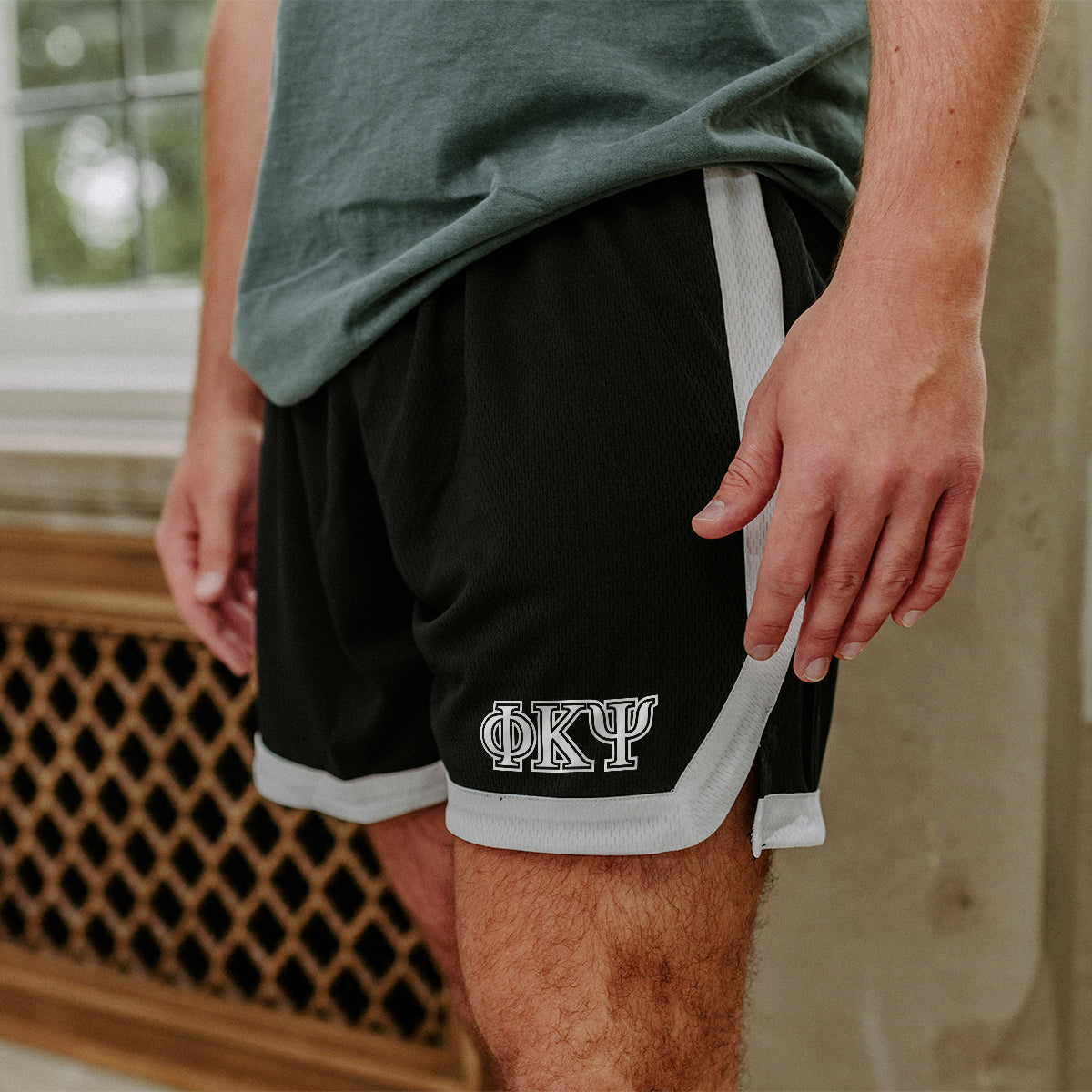 Phi Psi Greek Fraternity Black 7" Mesh Shorts with Greek letters.