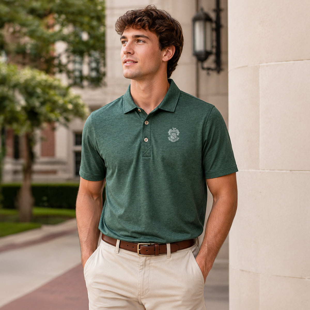 Model wearing a green heathered Cutter & Buck polo with an embroidered crest on the chest.
