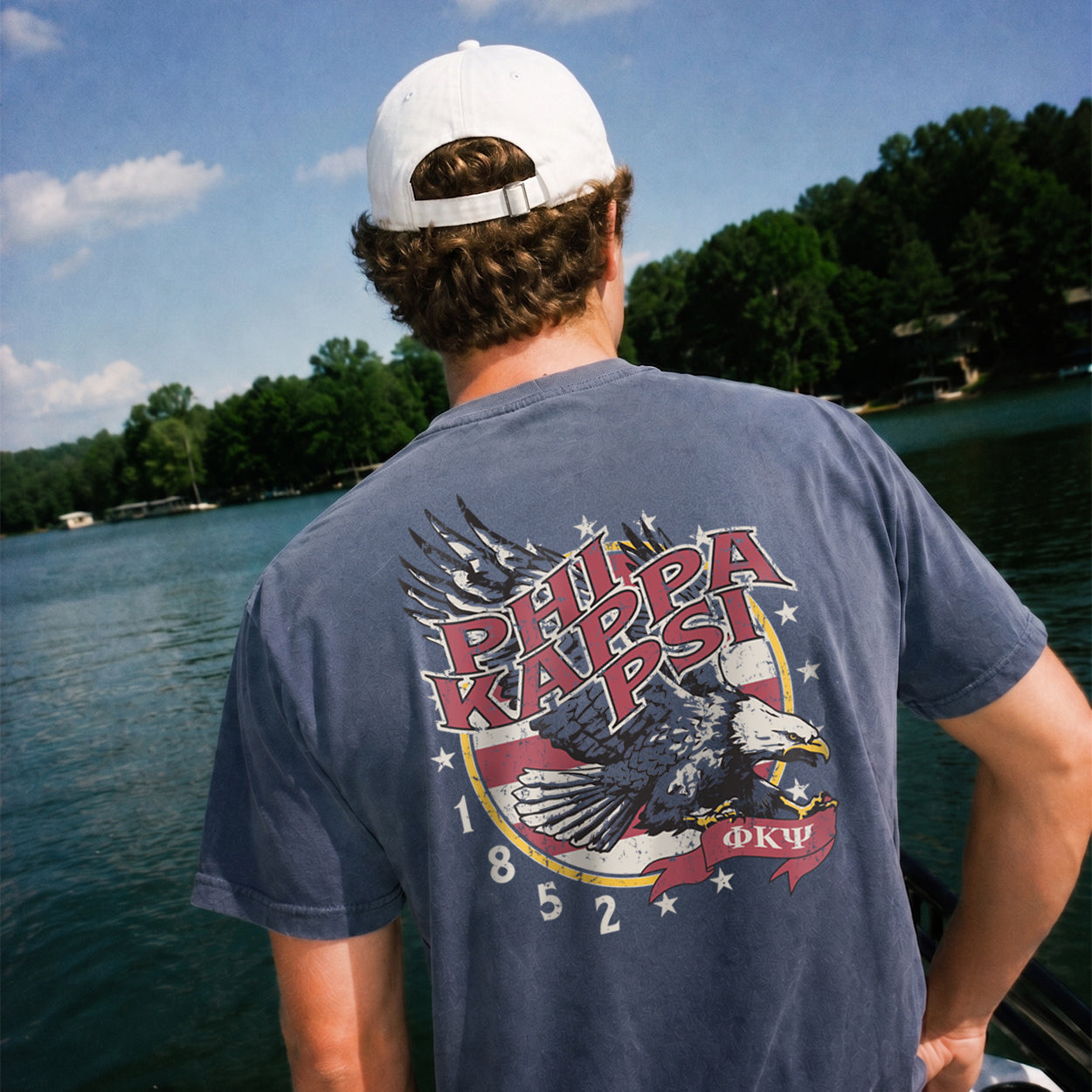 Man wearing a blue comfort colors tee with premium america design