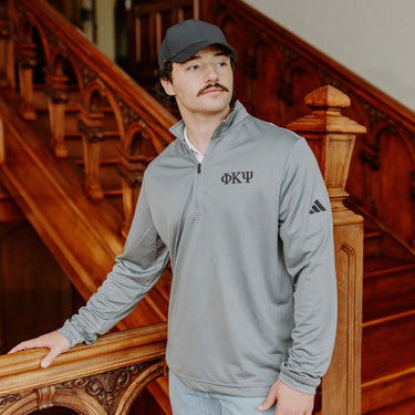 Phi Kappa PsiFraternity Grey Adidas Lightweight Performance 1/4 Zip with Greek letters.