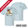 Light blue Comfort Colors t-shirt shown front and back; front features small Greek letters on the left chest, back displays a golden retriever sailing a boat with script text above and “Chasing Open Water” below.